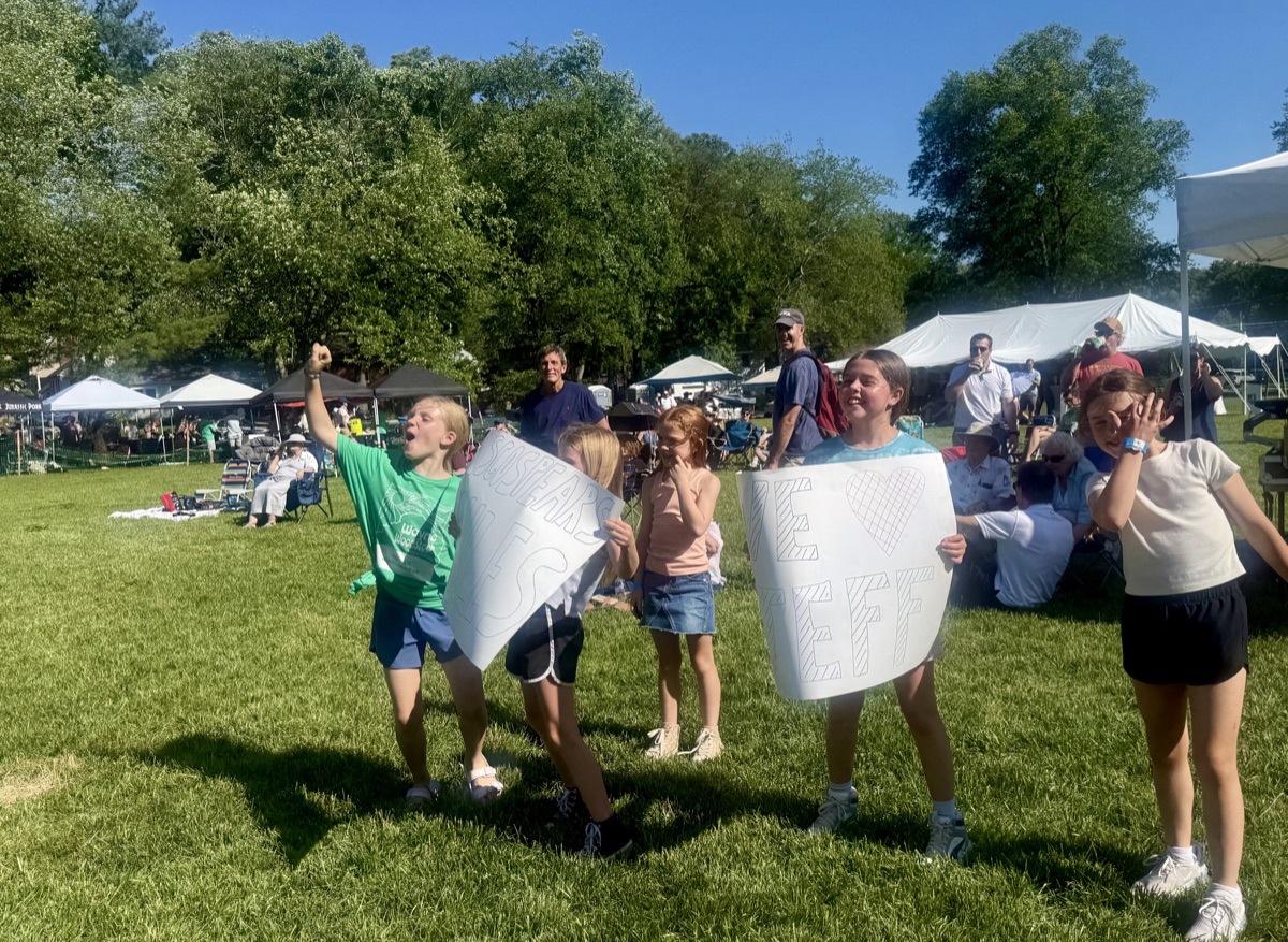 Kids having fun at Waynewoodstock with homemade signs